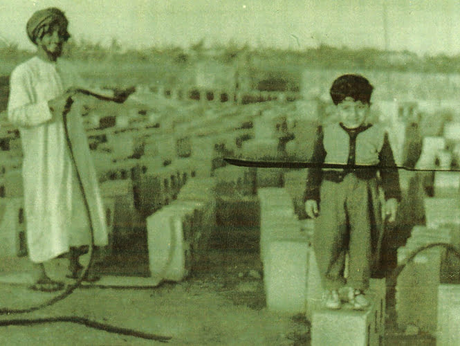 Old Photo Of Misan Al-Khamiri Standing On A Concrete Block As A Child